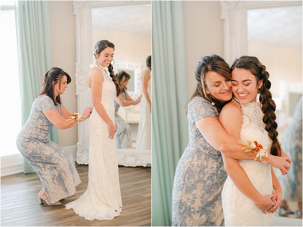 mom helping her daughter put her wedding dress on