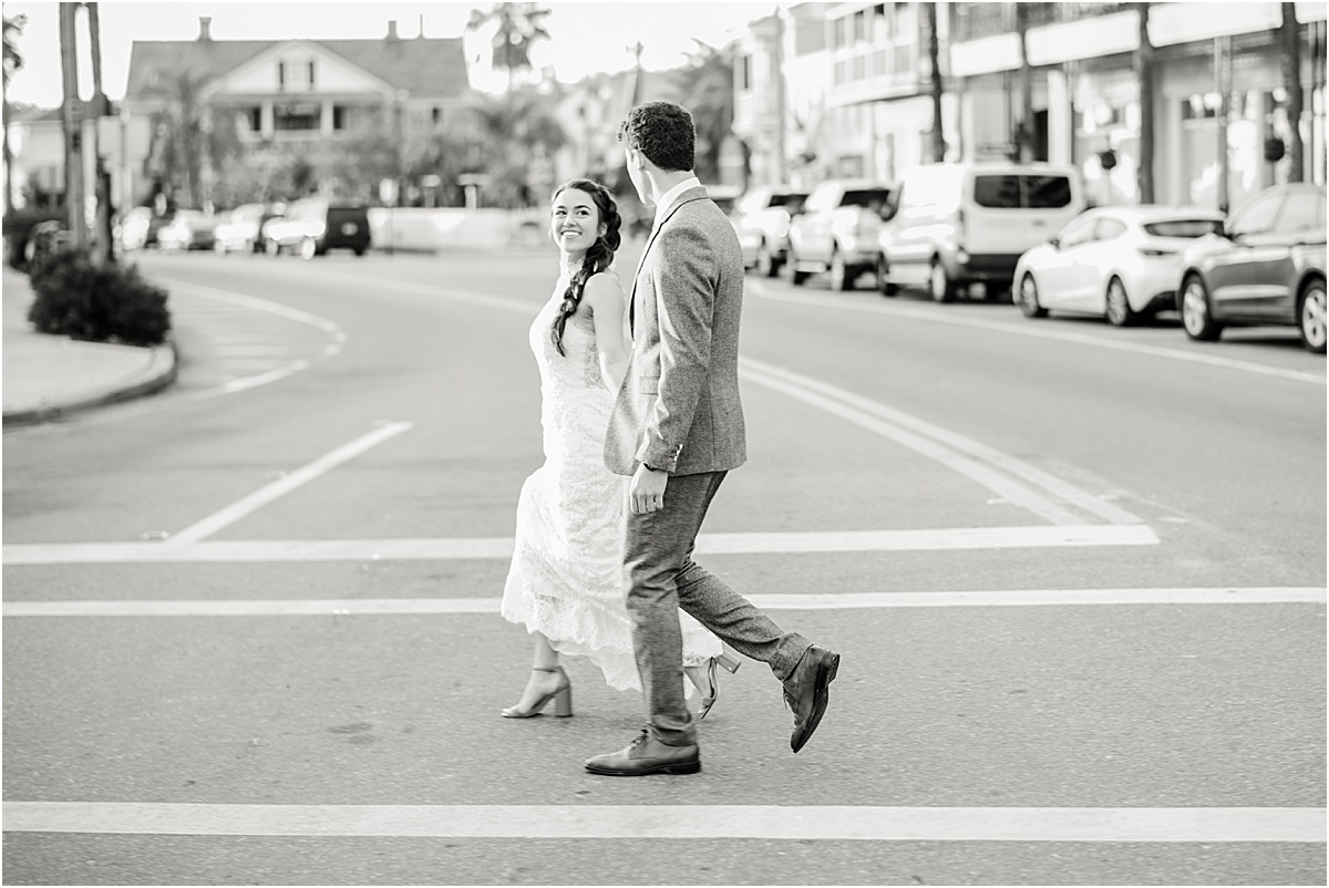 bride and groom crossing main street in downtown saint augustine
