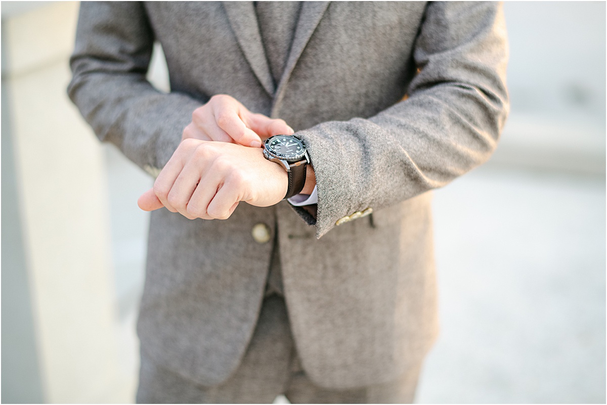 groom holding his watch