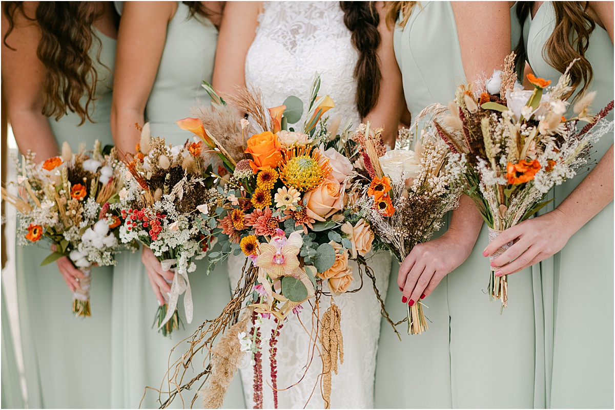 colorful bridesmaids floral with pampas and warm tones