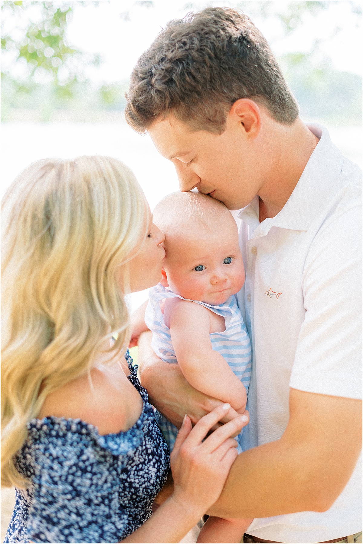 mom and dad kissing baby boy Atlanta Family Photographer