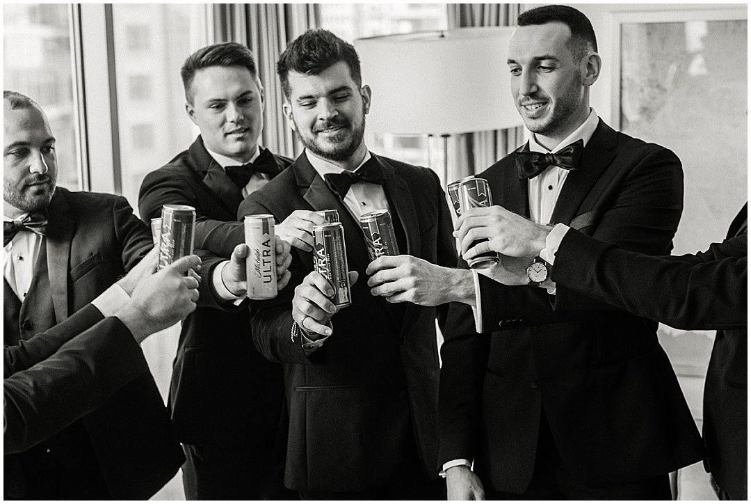 groom and groomsmen cheers photo