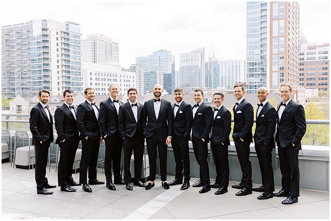groom and groomsmen photos with atlanta skyline