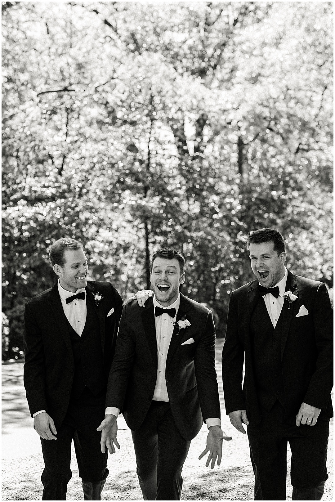 groom and groomsmen walking photo