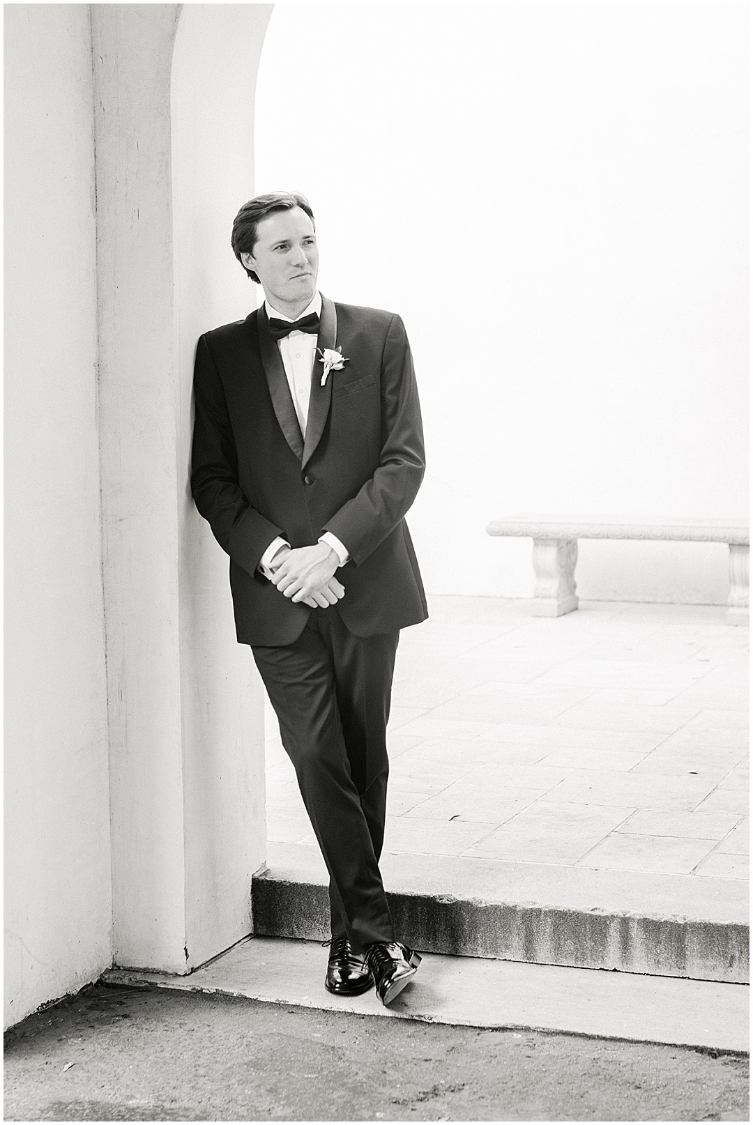 groom leaning photo