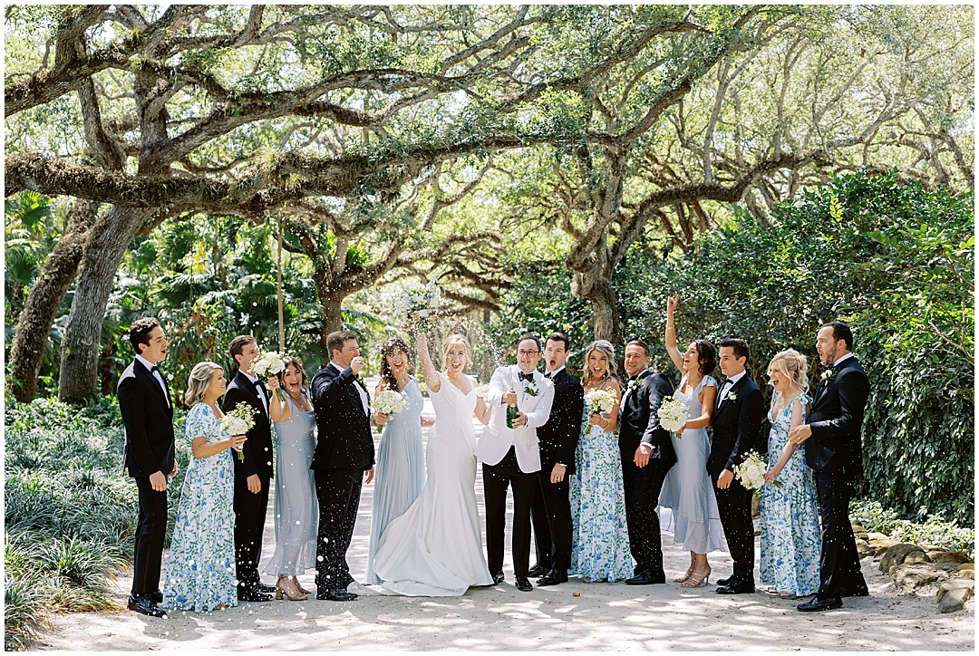 champagne pop with wedding party