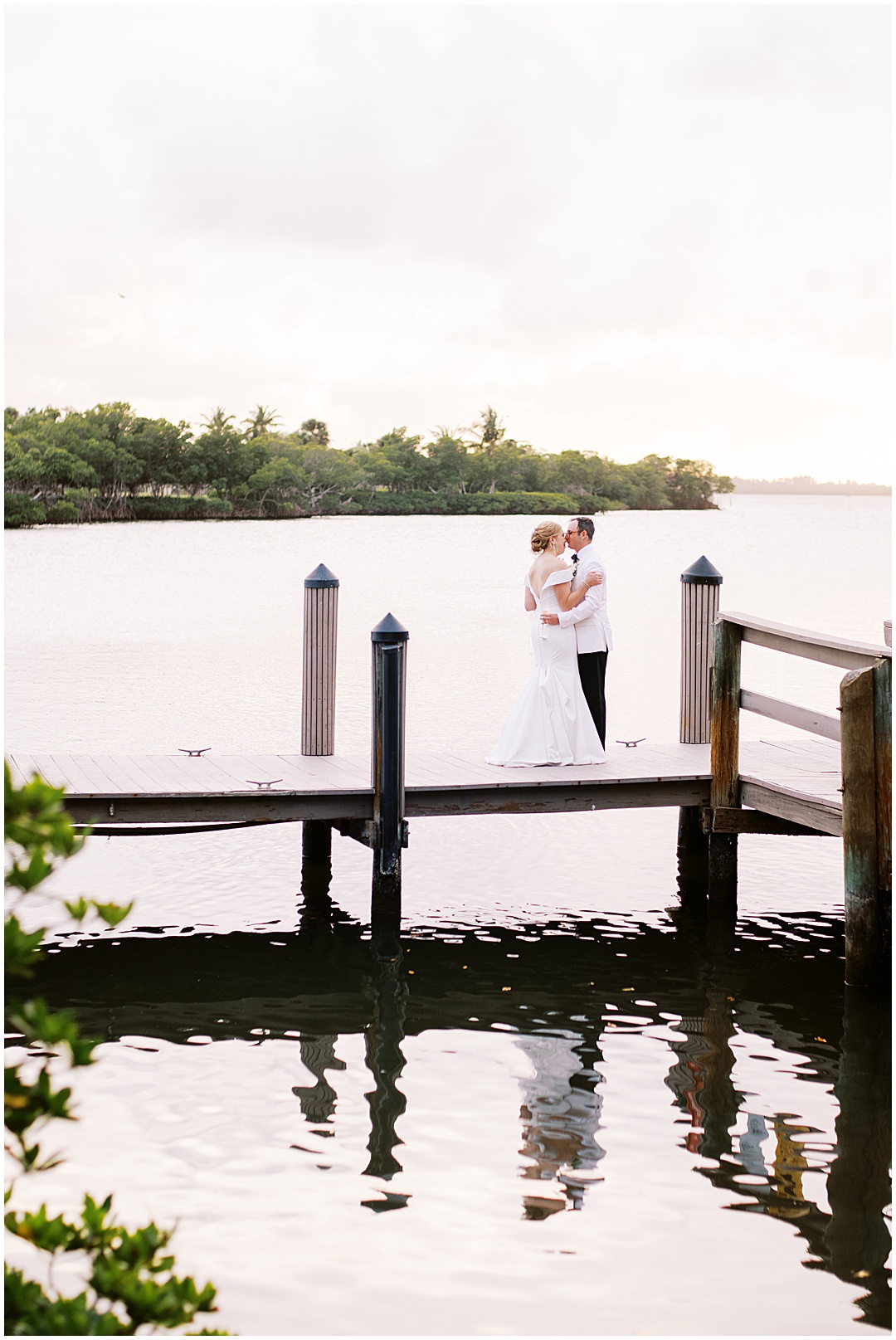 bride and groom on dock