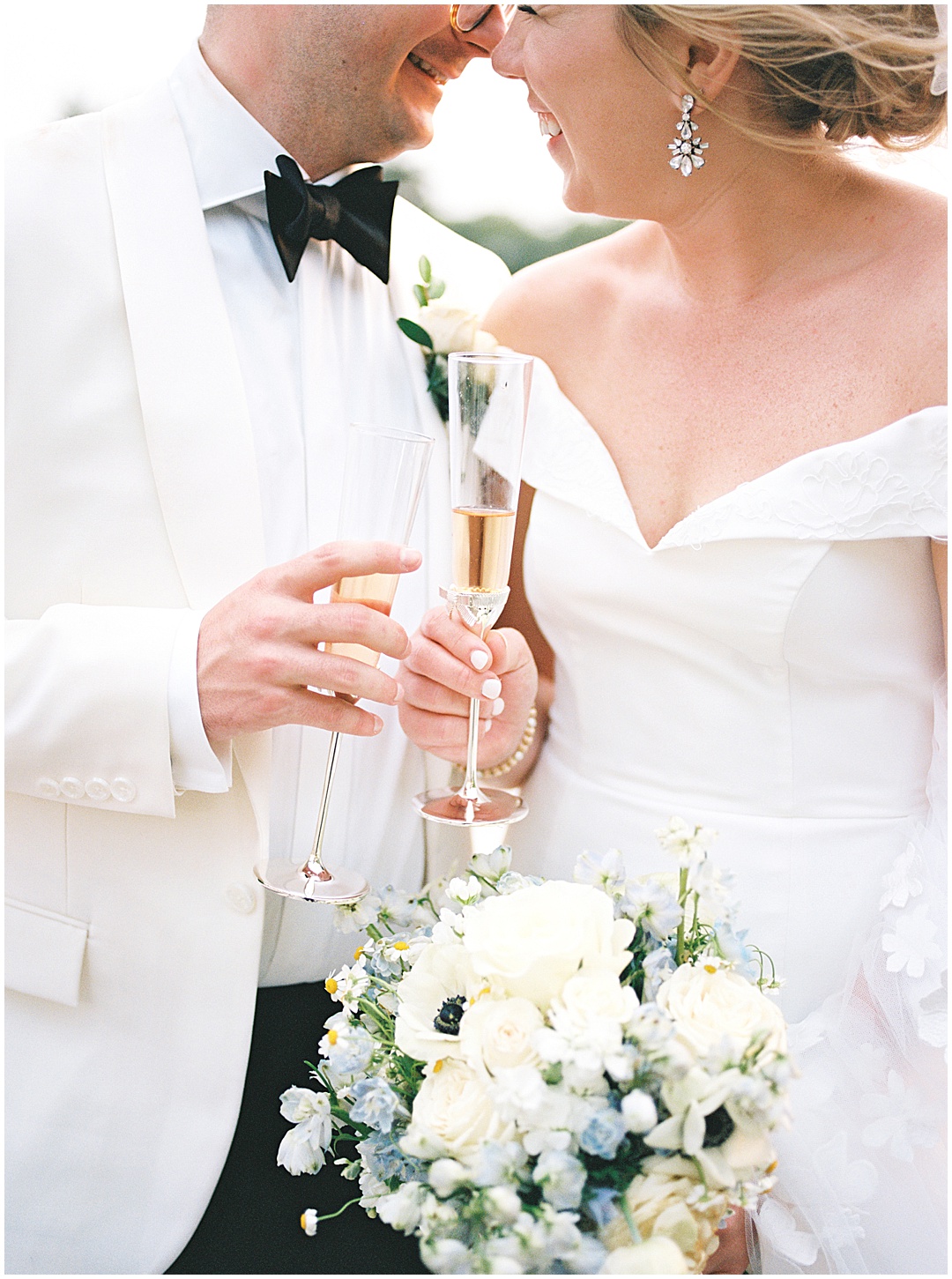 bride and groom with champagne glasses