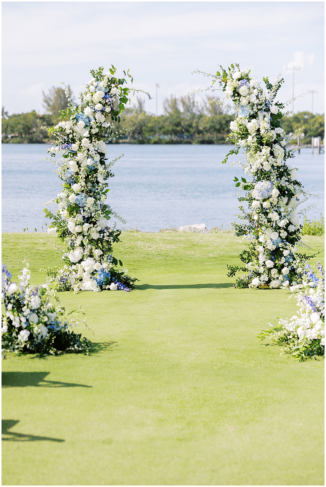 wedding floral arch with white and blue florals