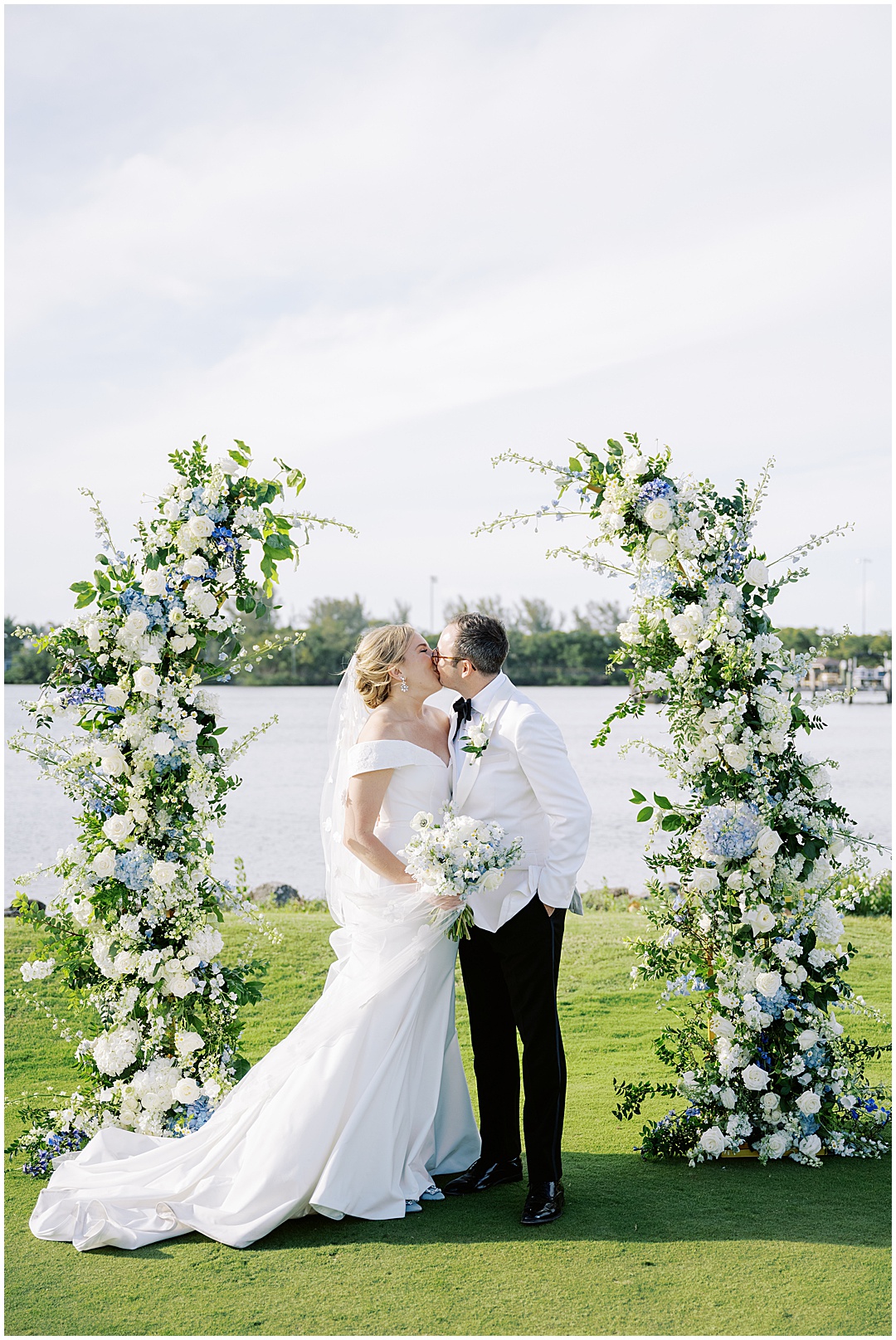 white and blue floral wedding arch