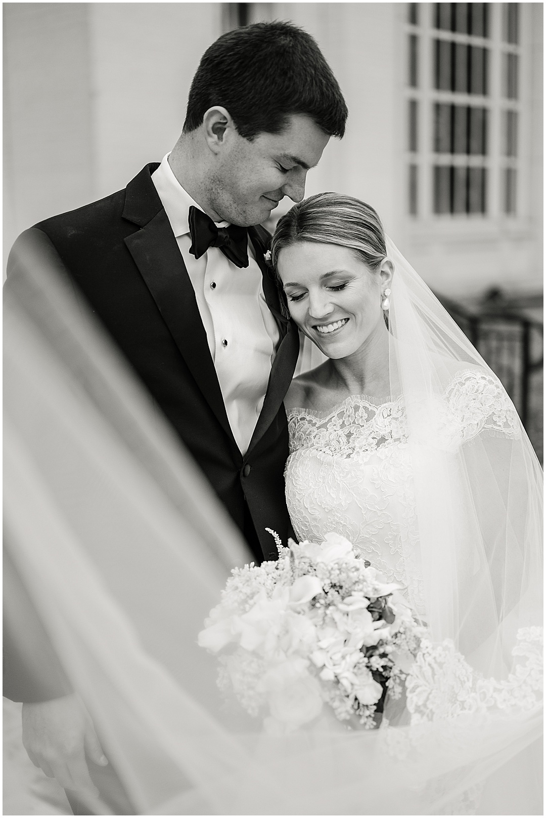 bride and groom wedding photo with veil