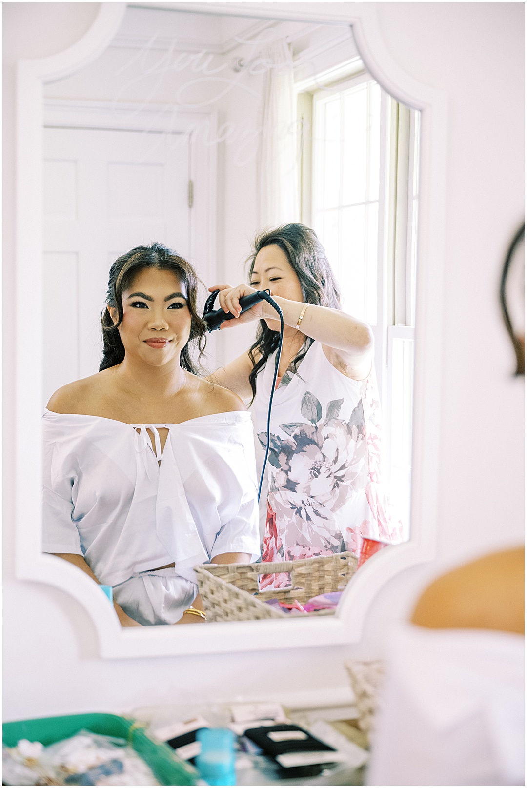 mother of bride doing brides hair