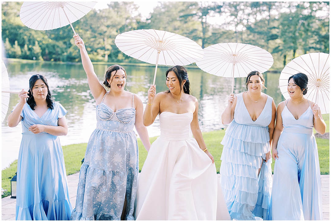 bride and bridesmaids with parasols