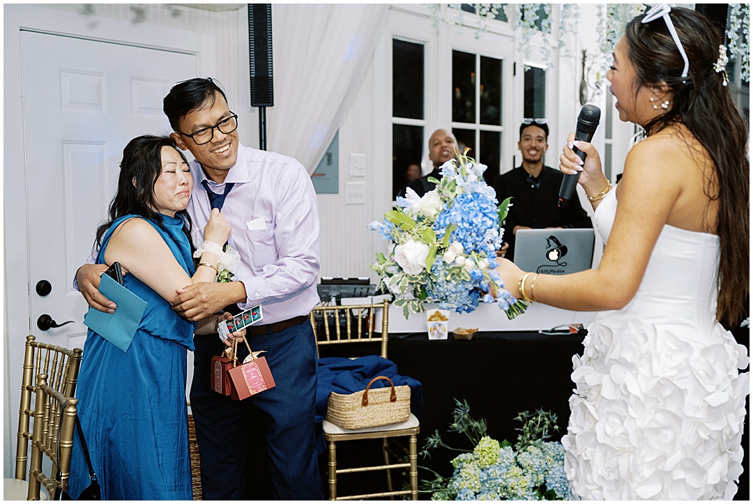 bride dedicating bouquet to mother