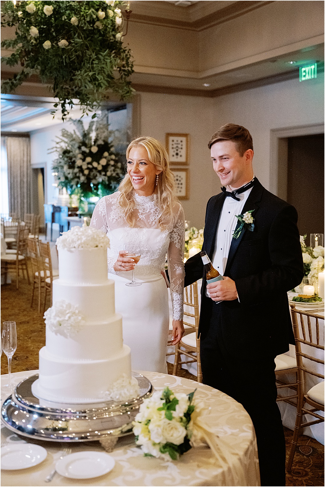 bride and groom cutting wedding cake