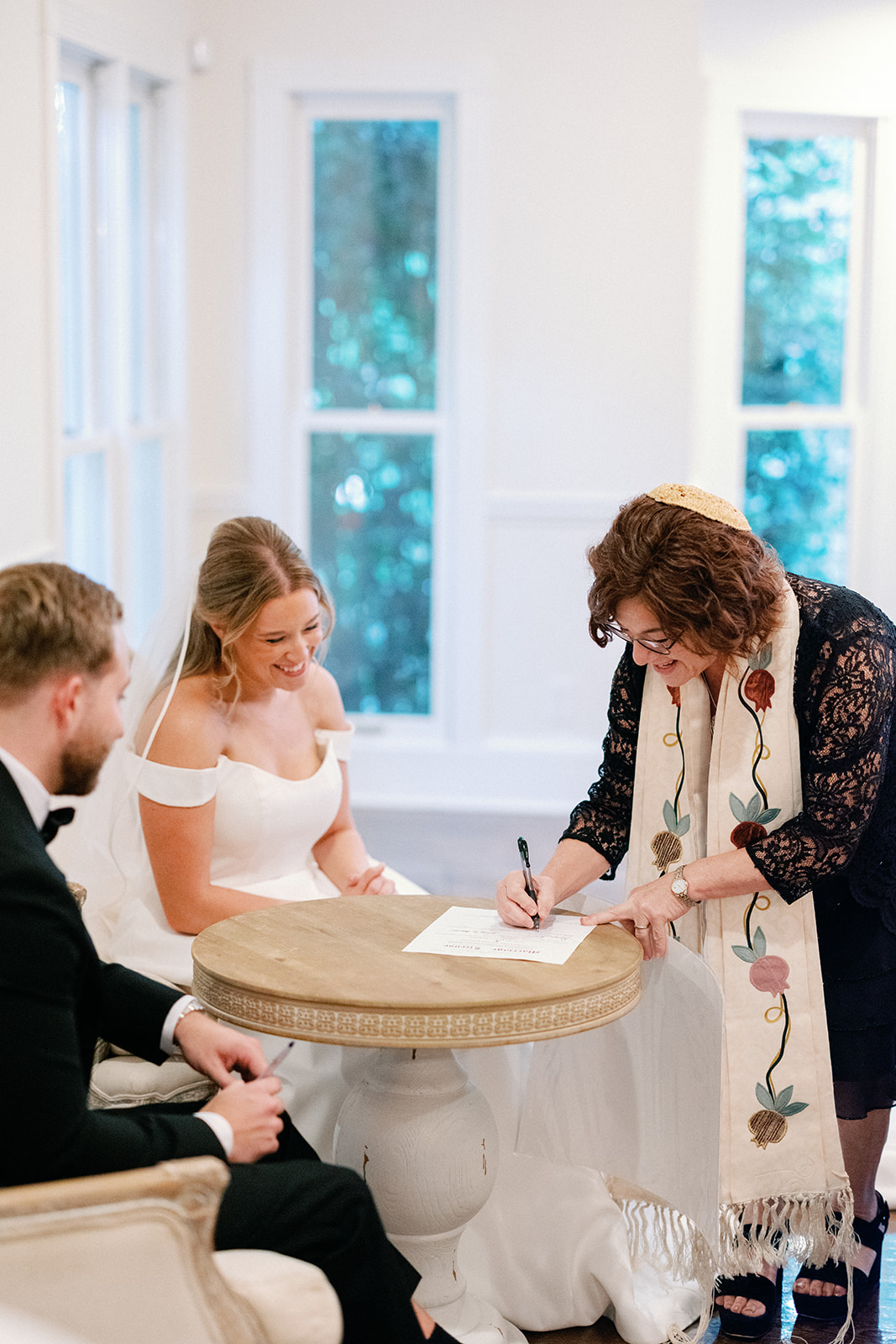 Couple Signing Ketubah at Little River Farms Wedding