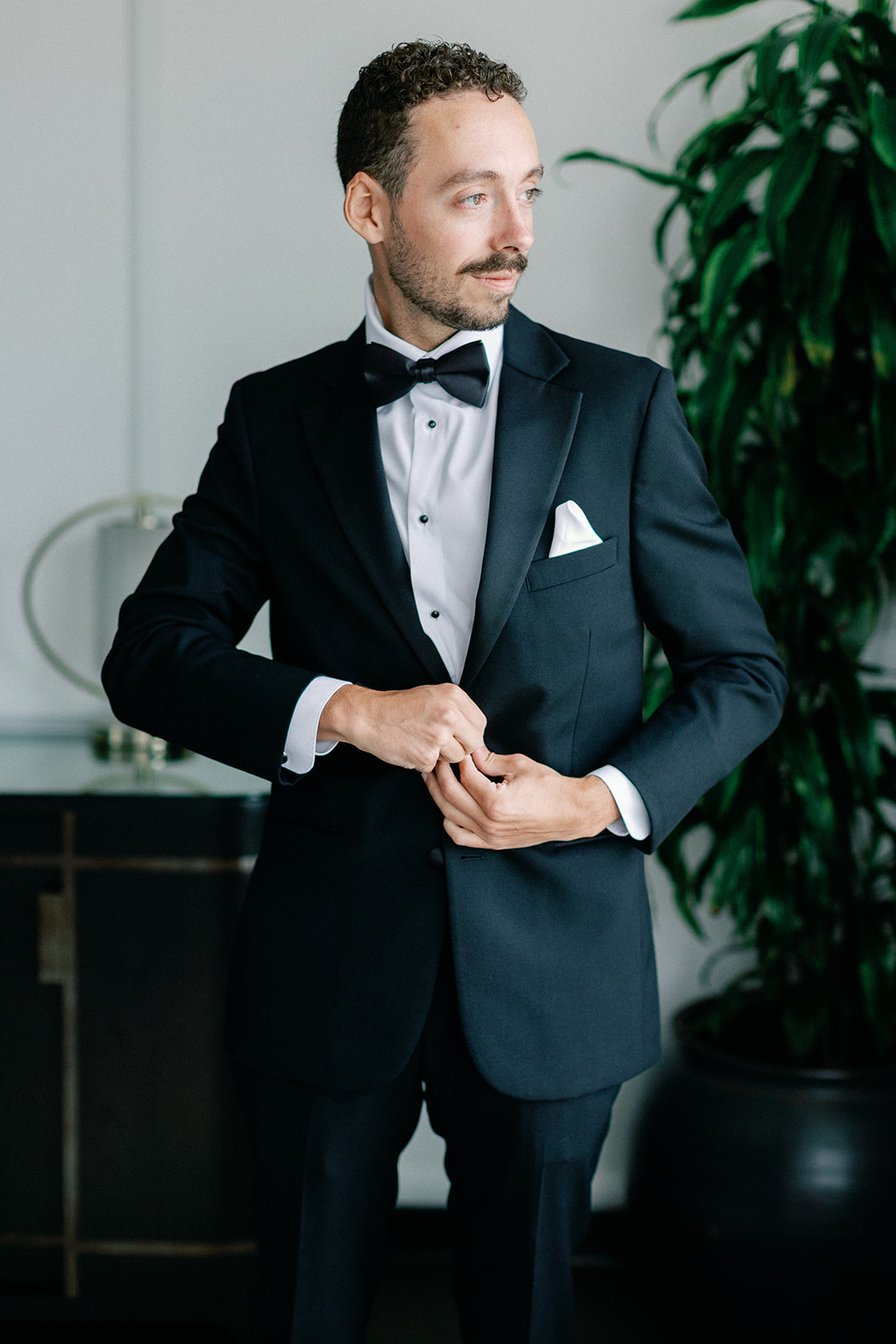 Groom Putting on Jacket at Intercontinental Hotel Atlanta