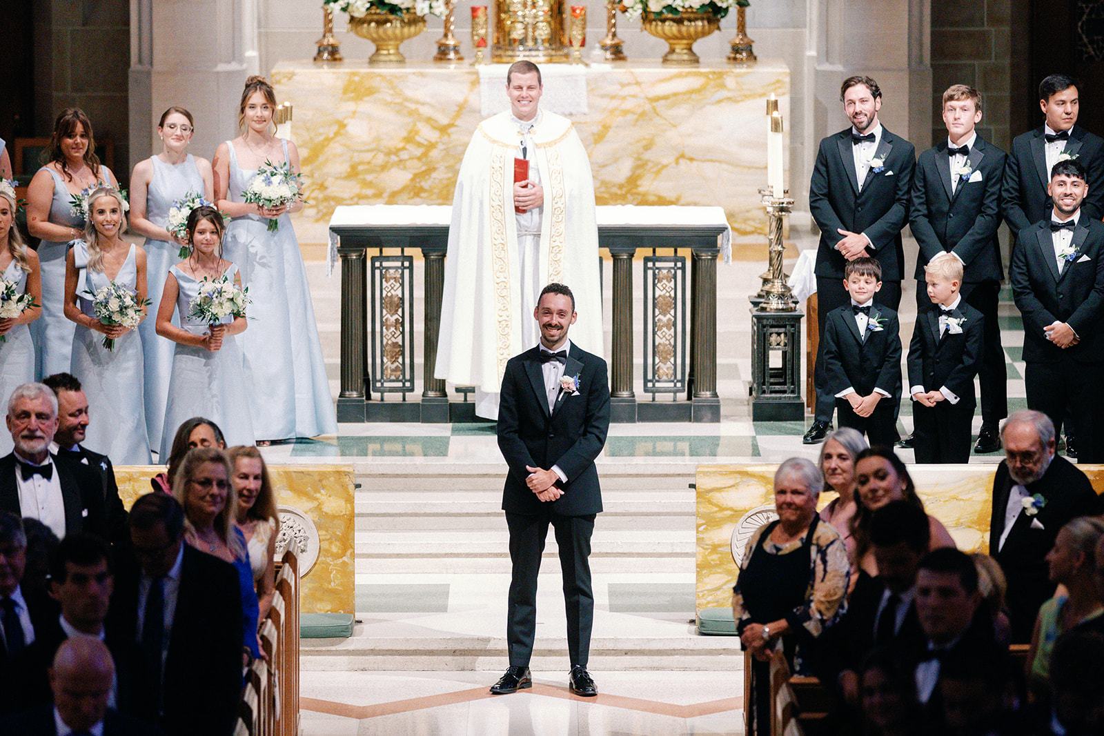 Groom Waiting for Bride to Walk Down Aisle at Church Wedding