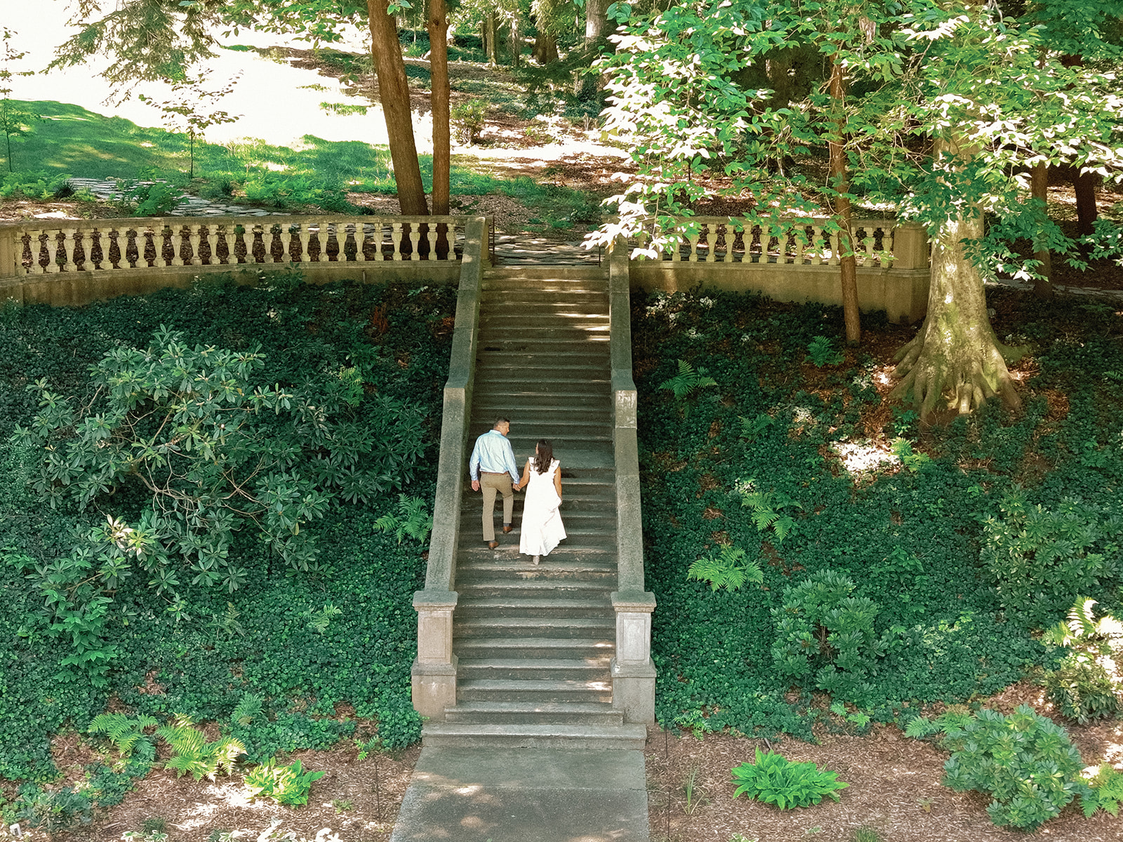Engagement Photo Locations in Atlanta - 6 Outdoor Spaces for Stunning Photos - engagement photo locations in atlanta Overhead View of Engaged Couple Holding Hands and Walking up Stone Stairs at Cator Woolford