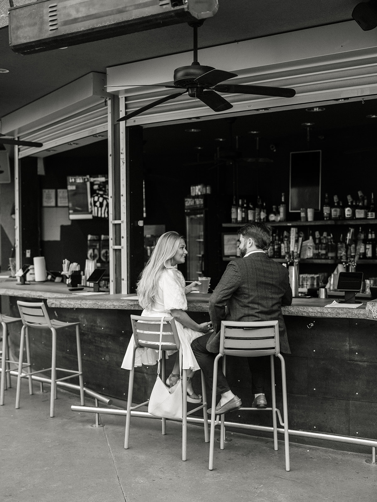 Engagement Photo Locations in Atlanta - 6 Outdoor Spaces for Stunning Photos - engagement photo locations in atlanta Couple Enjoy Drink at Open Air Bar During Atlanta Engagement Photoshoot