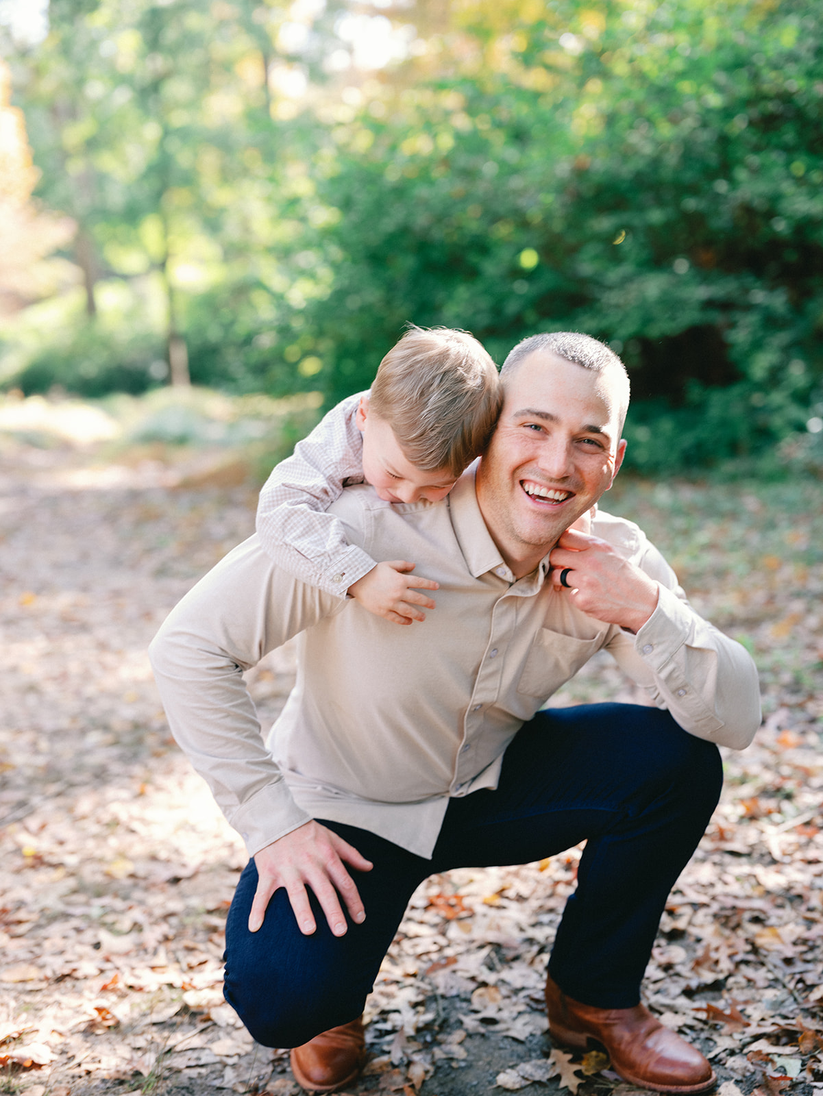 Fall Family Photos Atlanta - Mini Sessions - family photos atlanta Son Hanging on Dads Back for Fun Family Photos