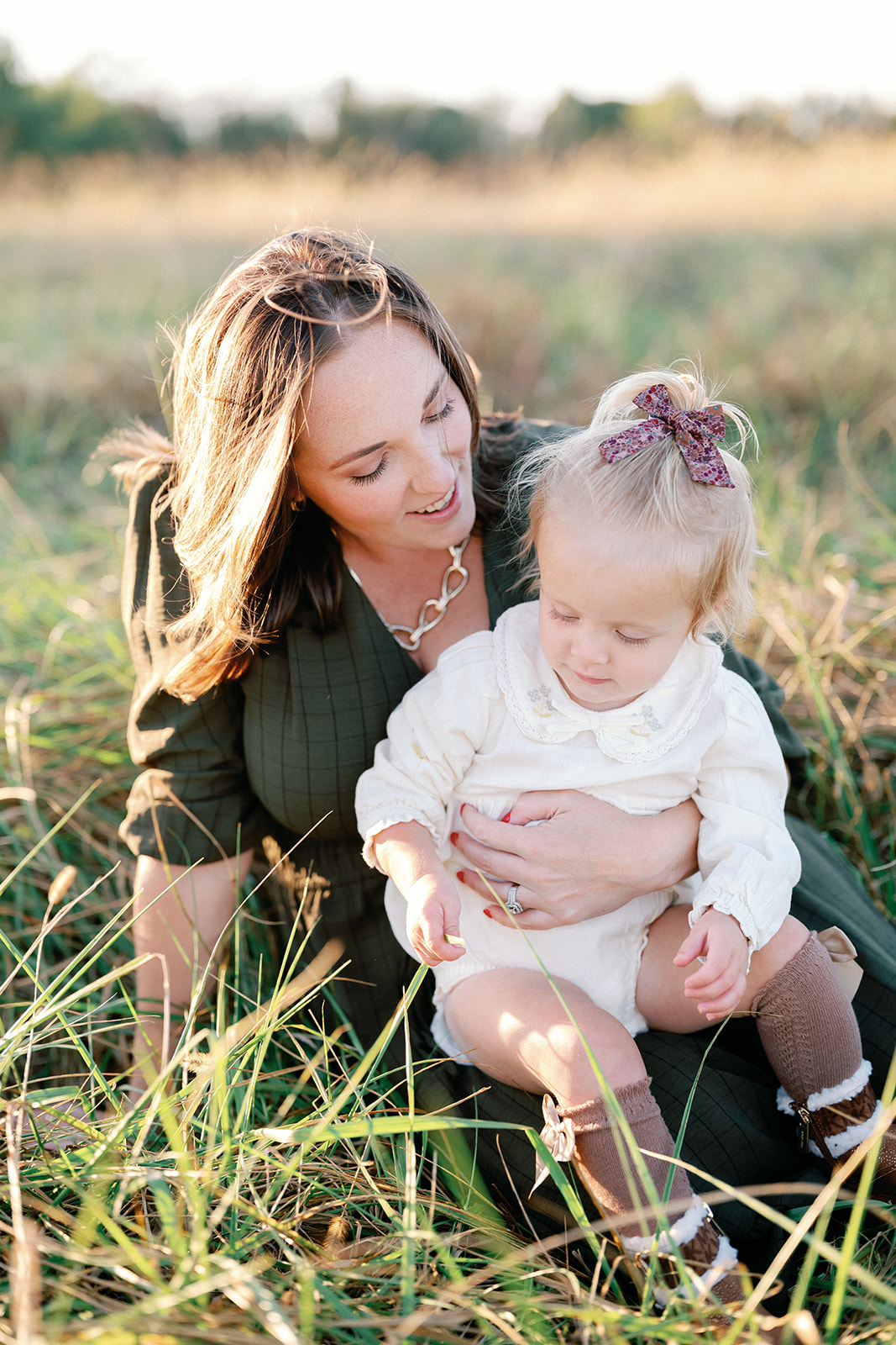 Fall Family Photos Atlanta - Mini Sessions - family photos atlanta Mom Holding Daughter in Sunset Filed During Family Photos