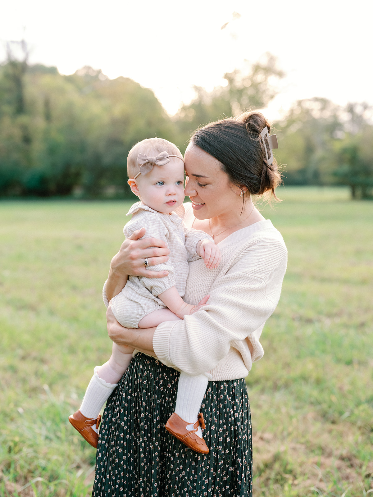 Fall Family Photos Atlanta - Mini Sessions - family photos atlanta Mom Holding Baby in Sunset Field During Family Photography