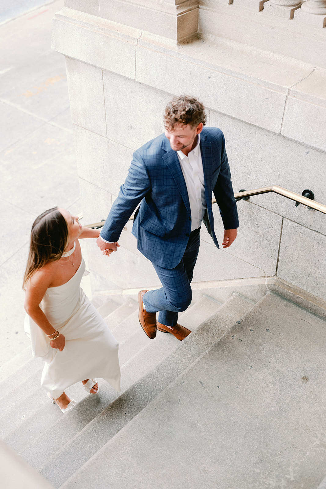 Engagement Photo Locations in Atlanta - 6 Outdoor Spaces for Stunning Photos - engagement photo locations in atlanta Engaged Couple Walk up Stairs at Georgian Terrace in Atlanta