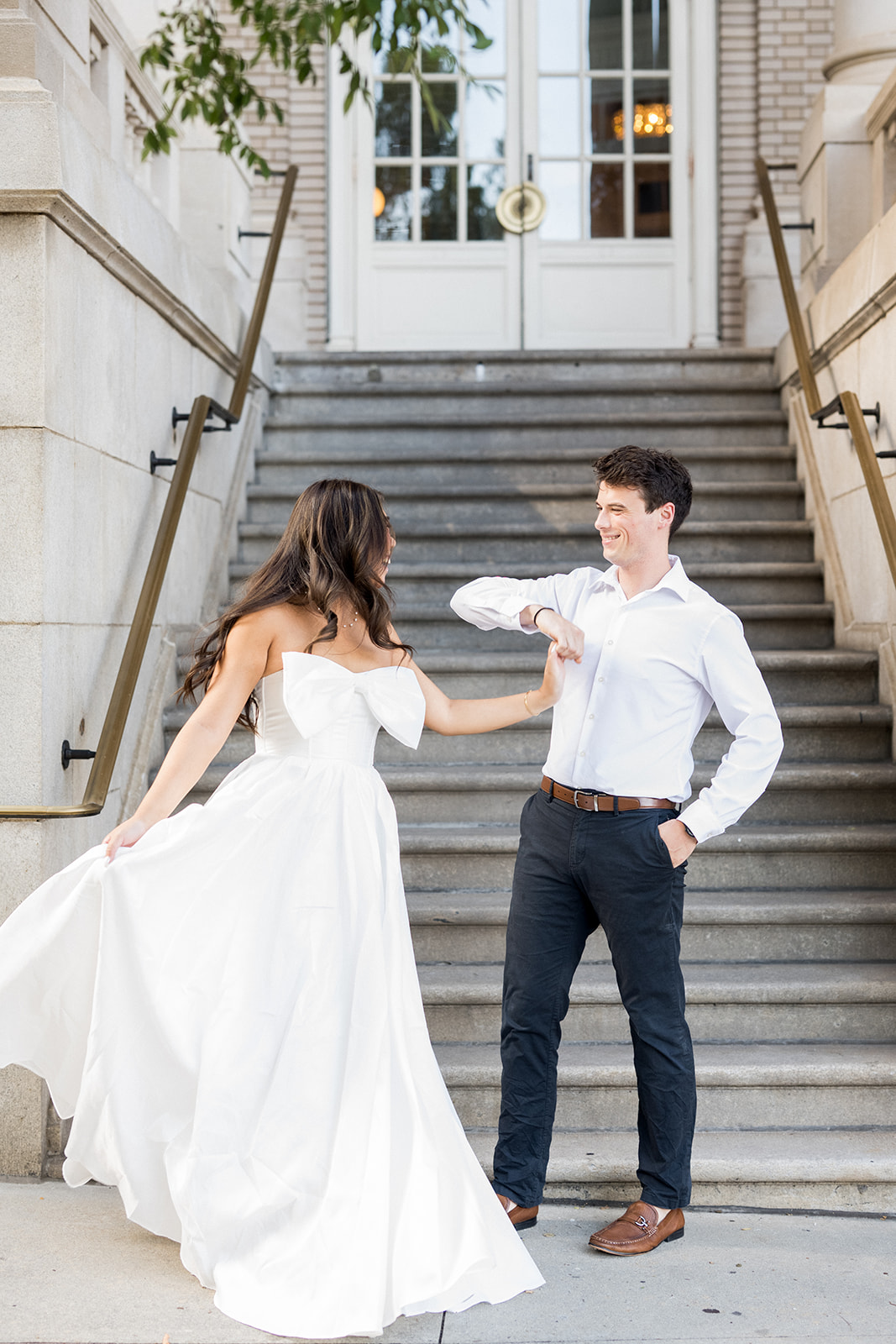 Engagement Photo Locations in Atlanta - 6 Outdoor Spaces for Stunning Photos - engagement photo locations in atlanta Bride and Groom to be Twirl at Base of Stairs, Georgian Terrace Atlanta