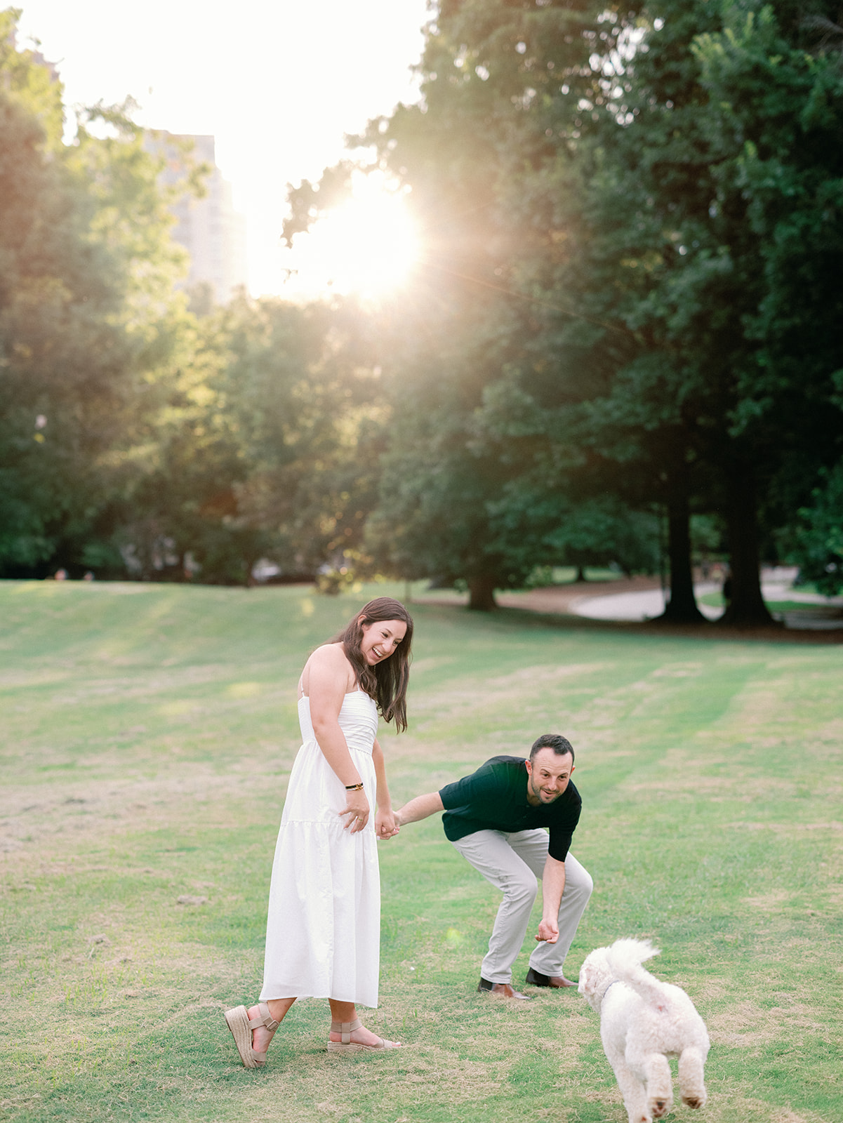 Engagement Photo Locations in Atlanta - 6 Outdoor Spaces for Stunning Photos - engagement photo locations in atlanta Dog Playful Runs Toward Couple During Engagement Photoshoot, Piedmont Park